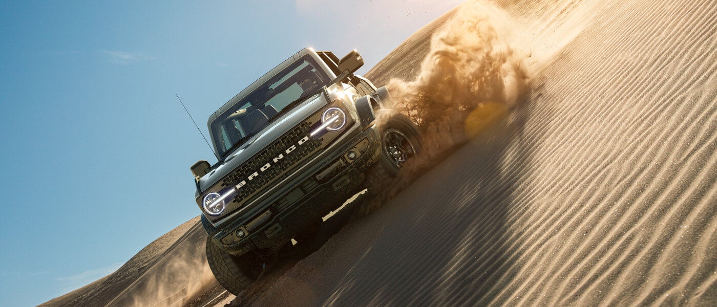 2024 Ford Bronco driving in sand dunes