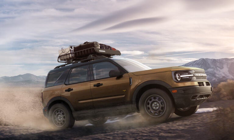 2024 Ford Bronco Sport driving in desert with luggage rack atop