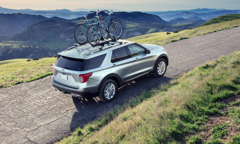 2024 Ford Explorer driving with bikes on top